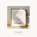Our Father Prayer watercolor art print in a natural oak frame on a rattan console, by Cherith.