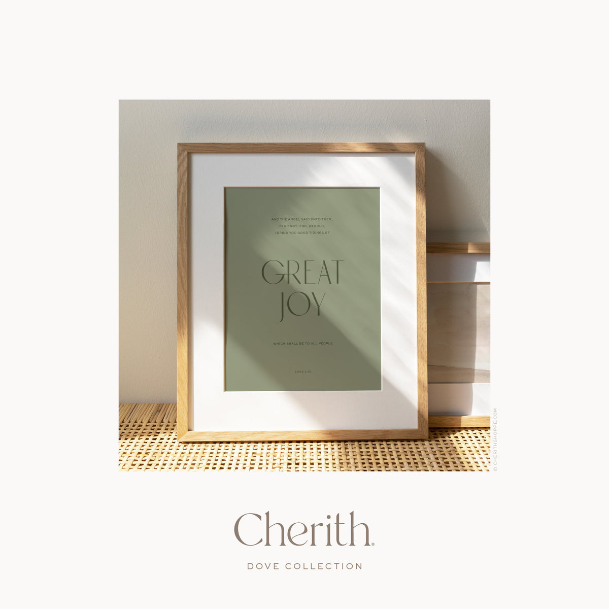 Great Joy Luke 2:10 green art print in an oak frame on a rattan console, by Cherith.