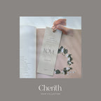 LOVE 1 John 4:11 bookmark with a ribbon resting on a Bible, by Cherith.