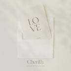 LOVE 1 John 4:19 card tucked into an envelope, by Cherith.