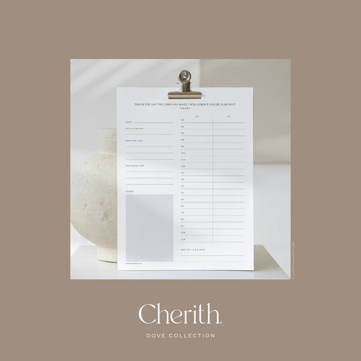 Psalm 118:24 daily planner on a clip beside a cream vase, by Cherith.